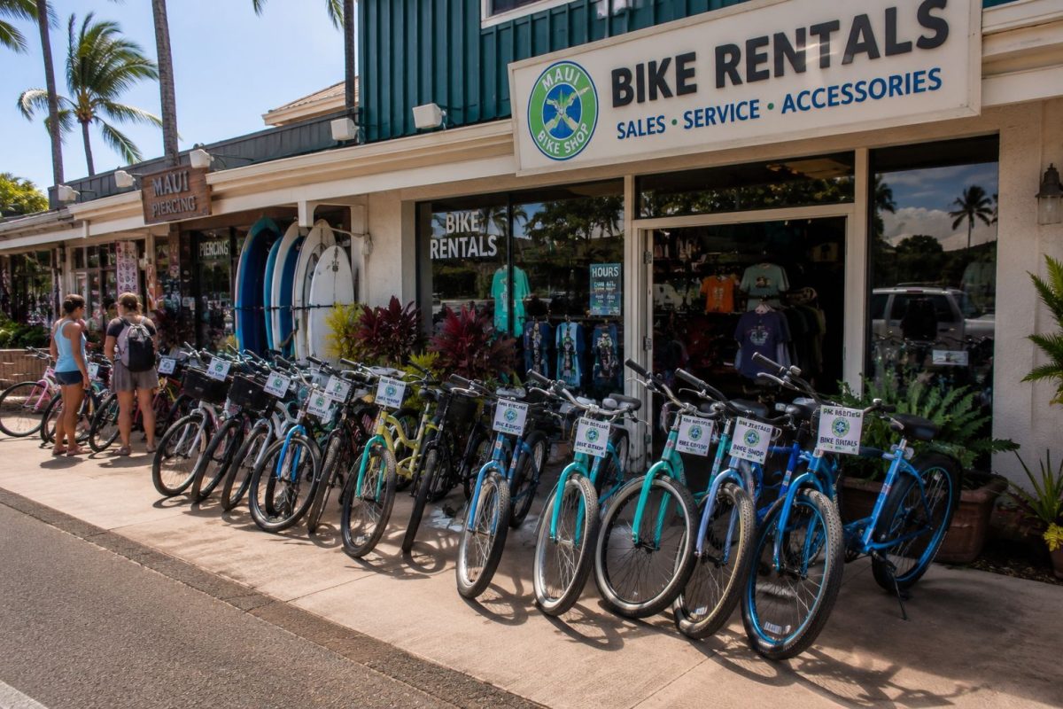 Colorful cruiser bikes lined up outside a rental shop on South Kihei Road