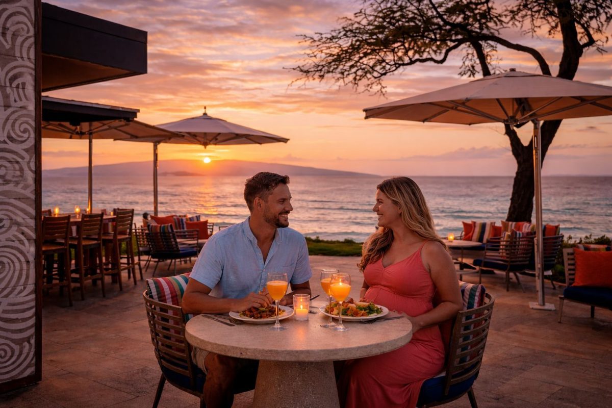 Couple enjoying a babymoon dinner at a Wailea oceanfront restaurant
